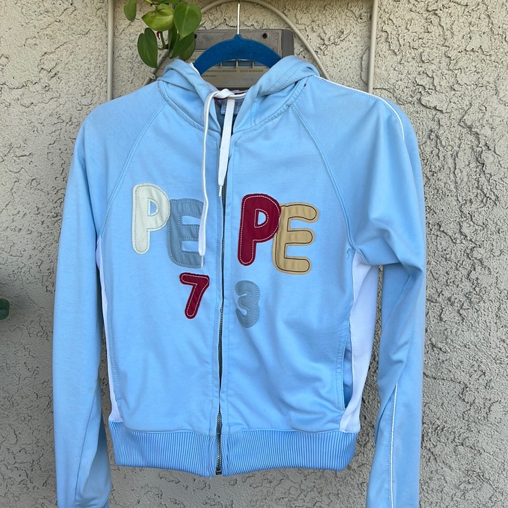 Woman’s PEPE Jean jacket. Size M light blue Pepe design on back and front.